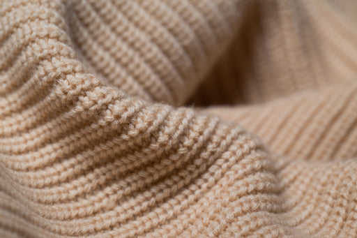 a swathe of woolen knitted fabric